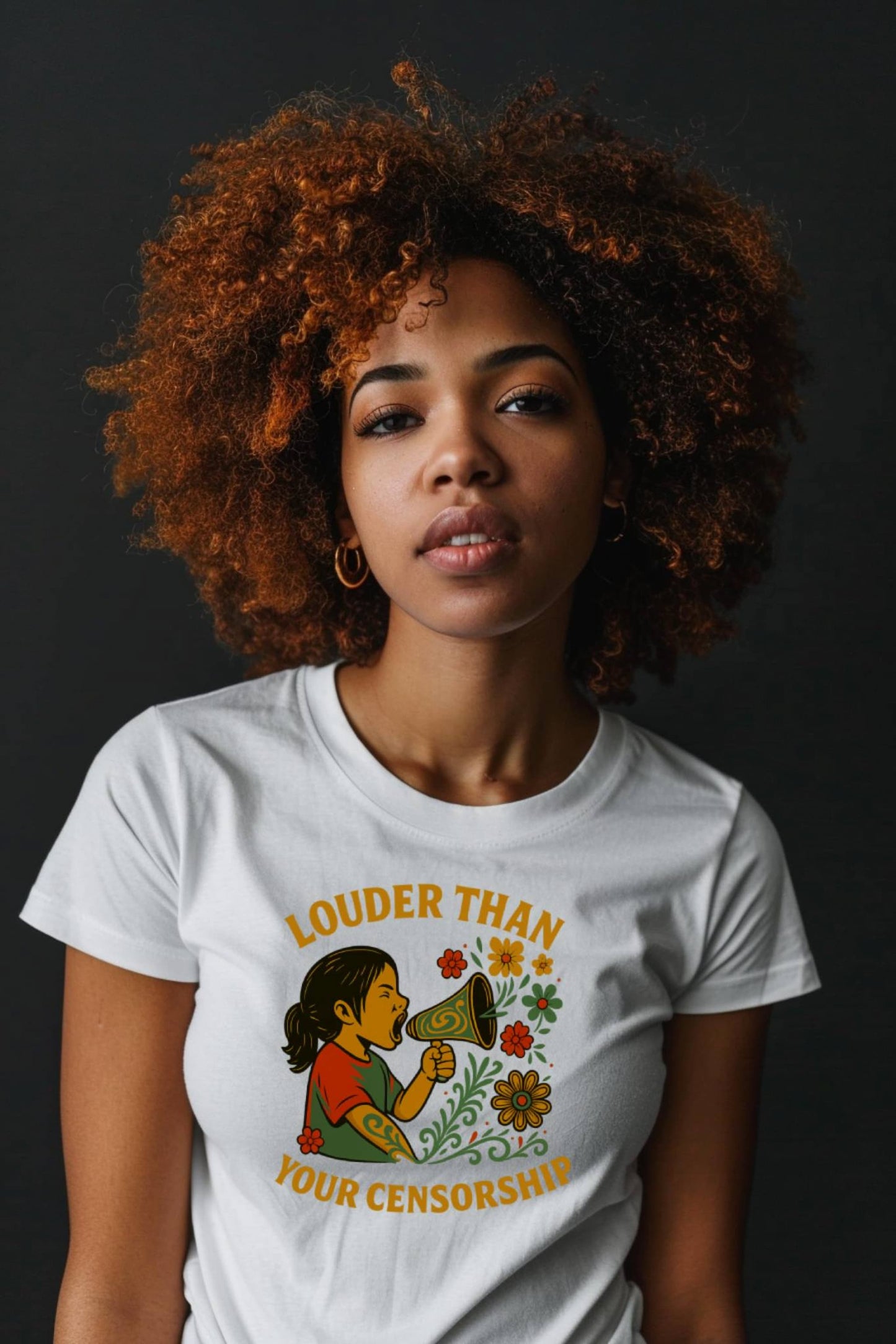 Woman wearing Louder Than Your Censorship t-shirt in white with colorful graphic and bold slogan