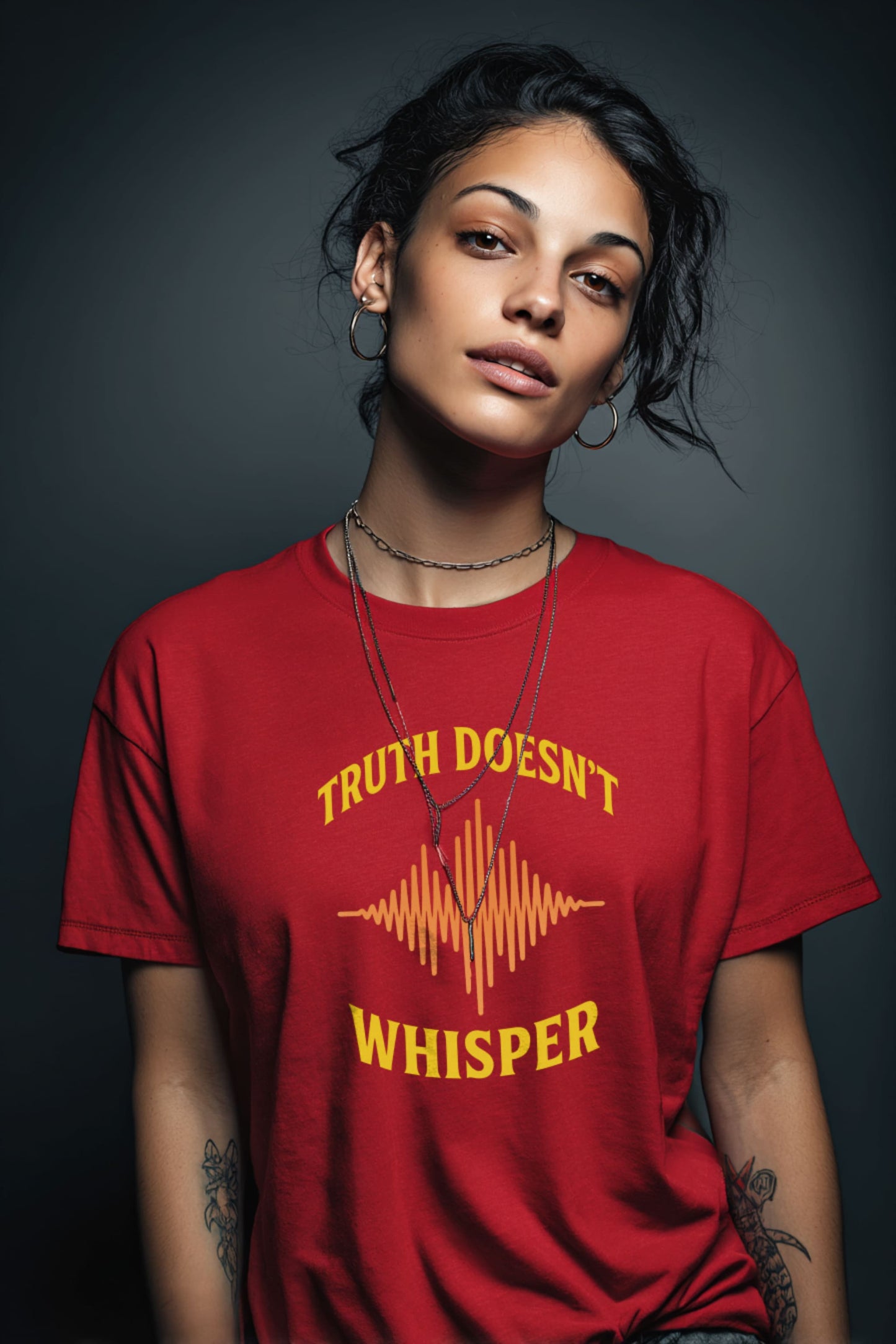 Model wearing Truth Doesn’t Whisper t-shirt in red, bold graphic protest tee