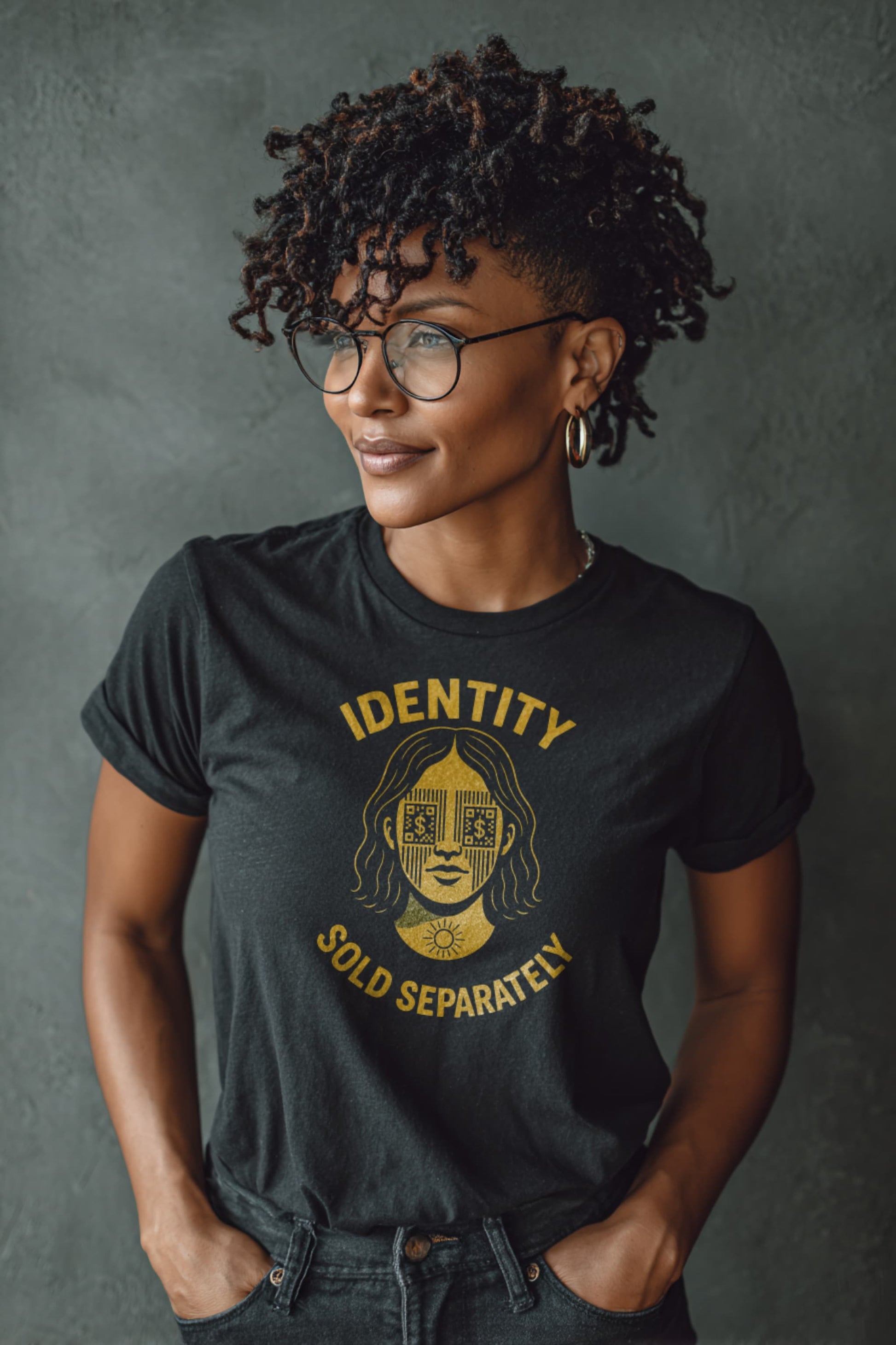 Woman wearing Identity Sold Separately t-shirt in dark grey with bold activist design