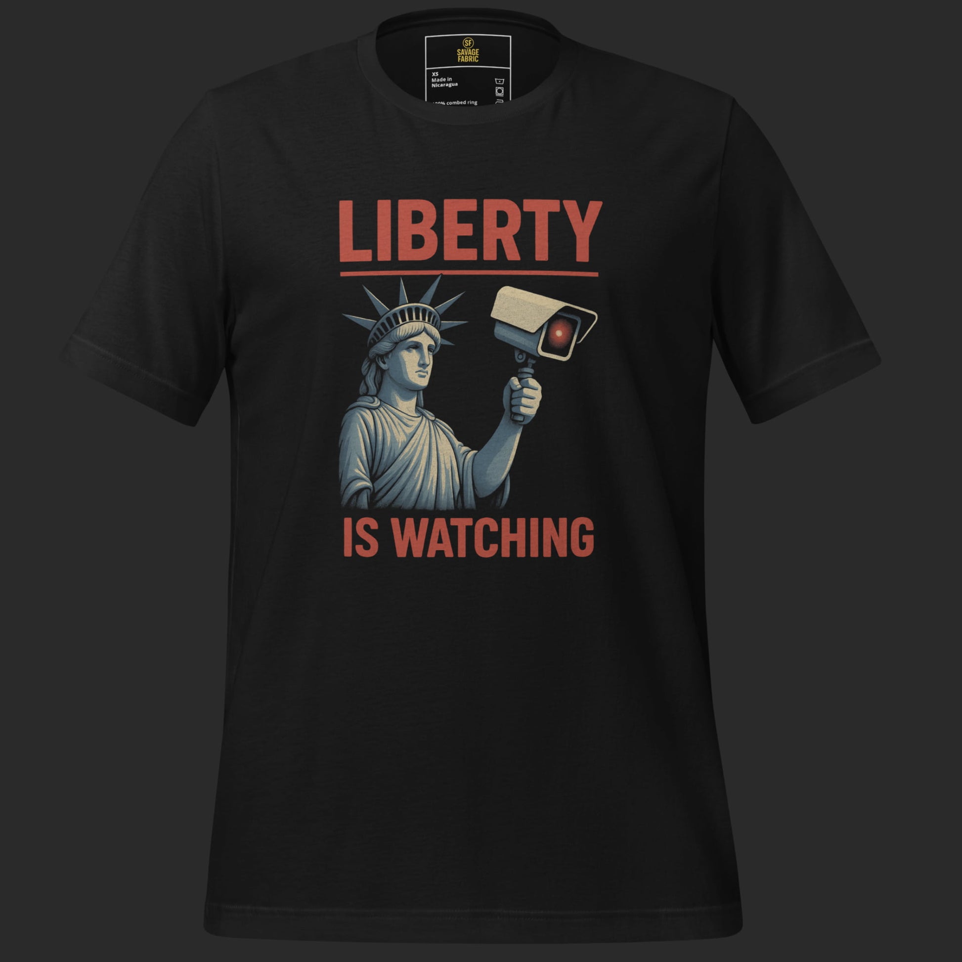 Close-up of Liberty Is Watching t-shirt in black with bold protest statement