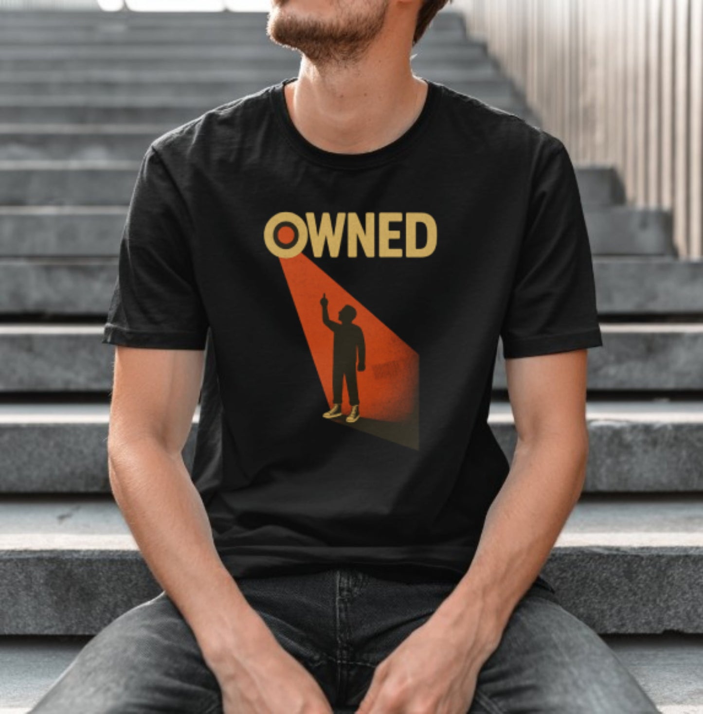 Owned t-shirt with bold statement graphic highlighting rebellion against control